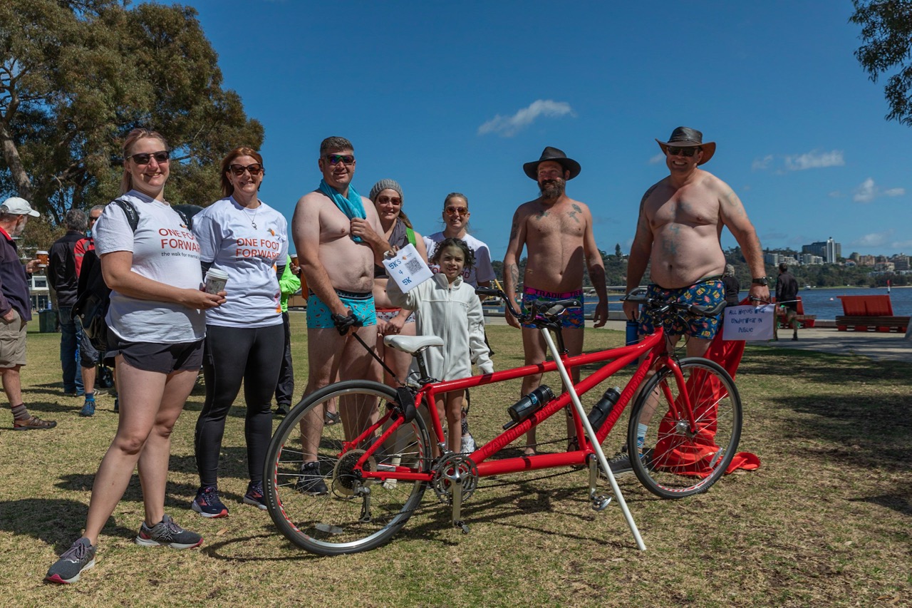 A group of walkers dressed in bright underwear were collecting donations for cancer research and stopped by to check out a bright red tandem.